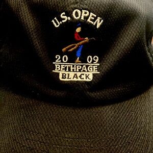 Black polyester imperial golf cap.